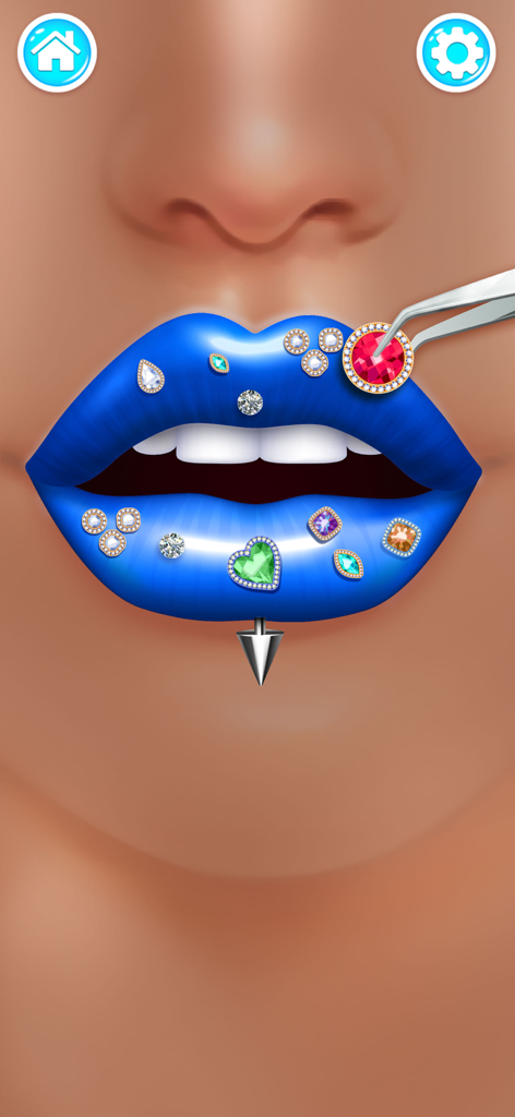 A digital makeup game showing blue lips being decorated with various colorful gemstones and jewelry using tweezers