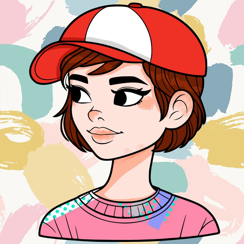 woman with short hair and a ball cap