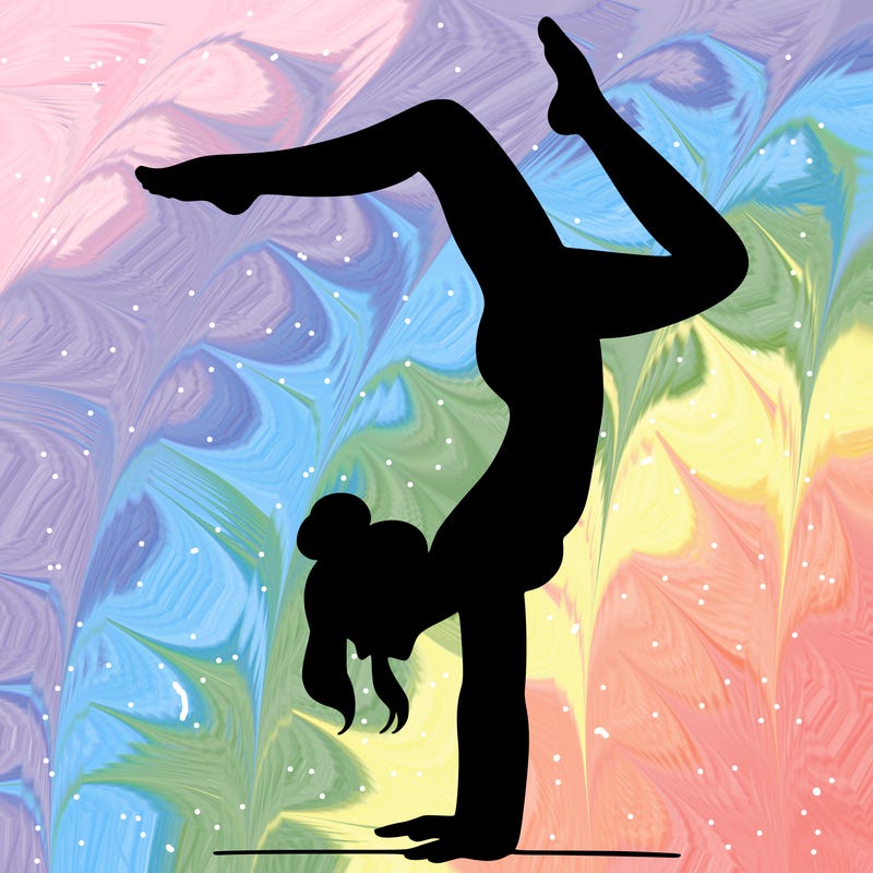 a woman doing a handstand