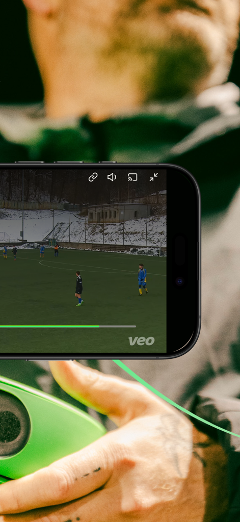 A person watching a live soccer match on their phone using the Veo Live app.