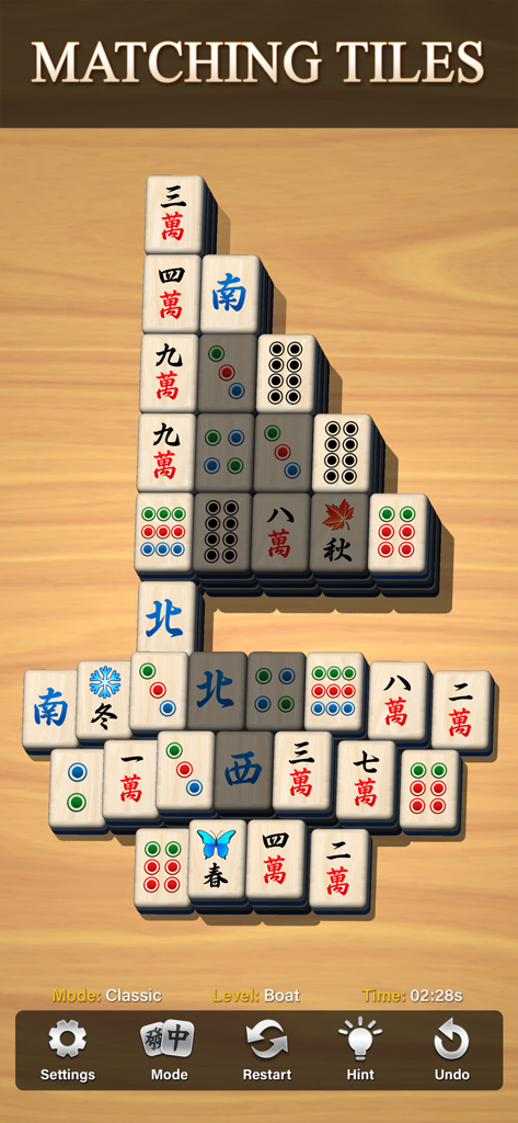 Un tablero de solitario Mahjong en modo vertical con fichas clásicas de emparejar dispuestas en forma de barco