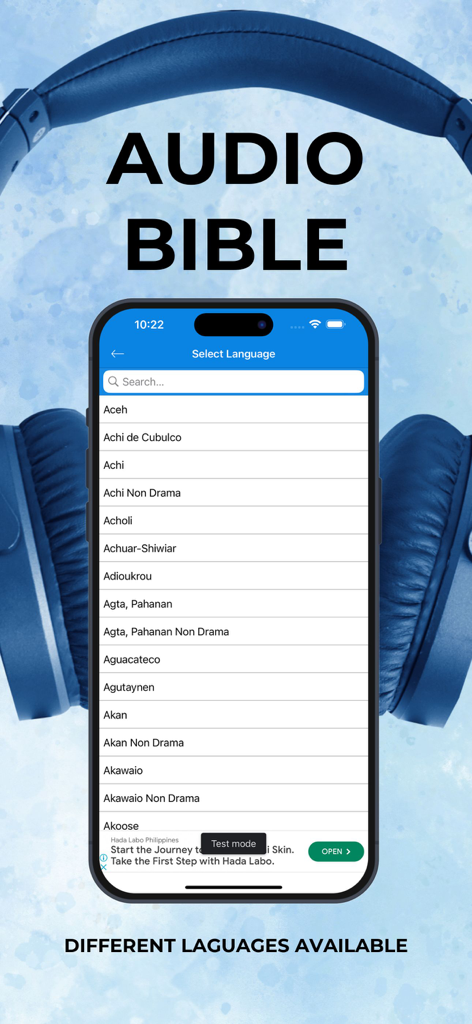 A smartphone displaying a list of various languages in the Audio Bible app with blue headphones in the background.