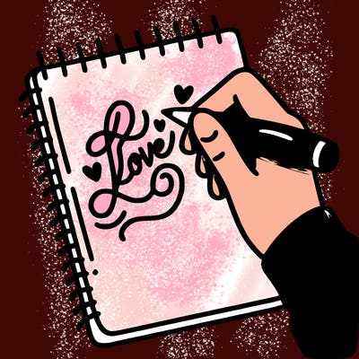 a hand writing “love” in calligraphy on a notebook