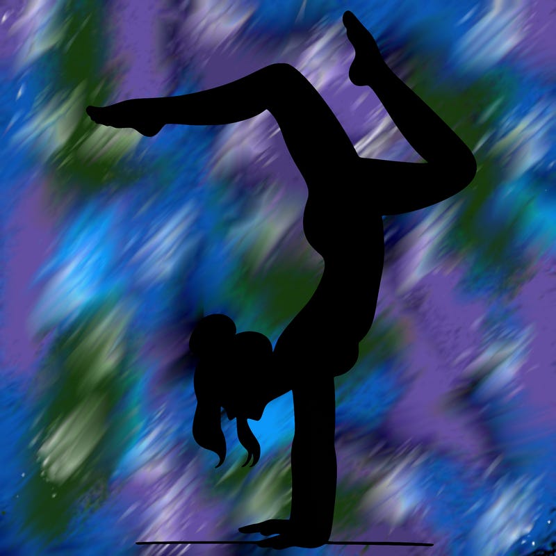 a woman doing a handstand