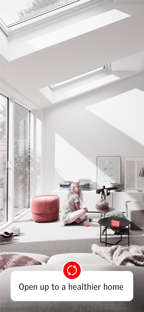VELUX ACTIVE with NETATMO - Children playing in a sunlit modern living room with VELUX smart roof windows