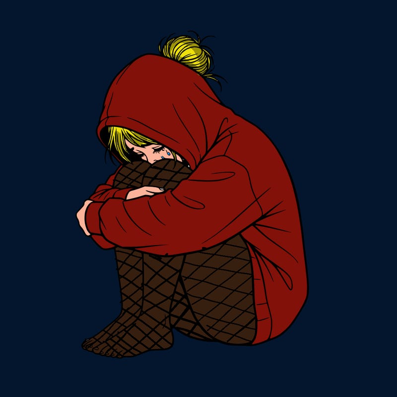 girl crying with hoodie over her hair and hair in bun