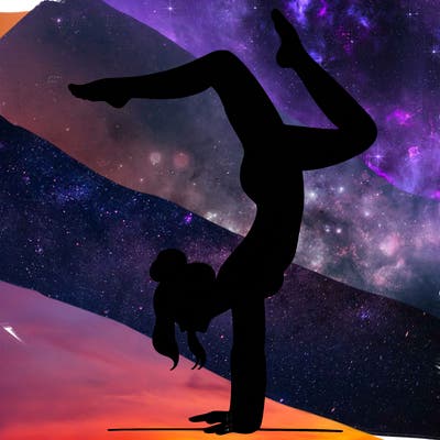 a woman doing a handstand