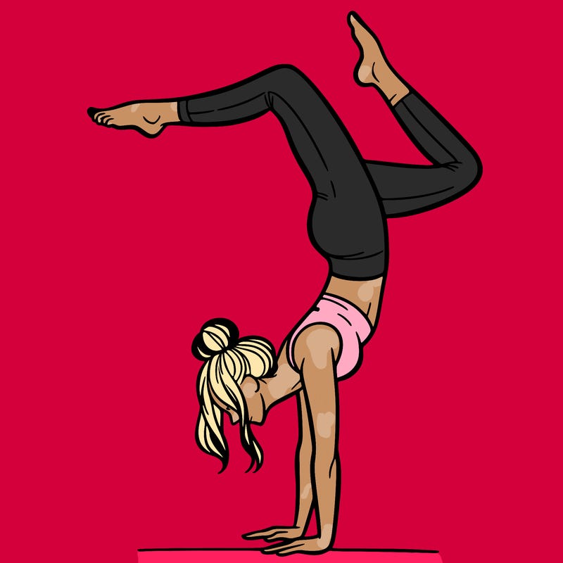 a woman doing a handstand