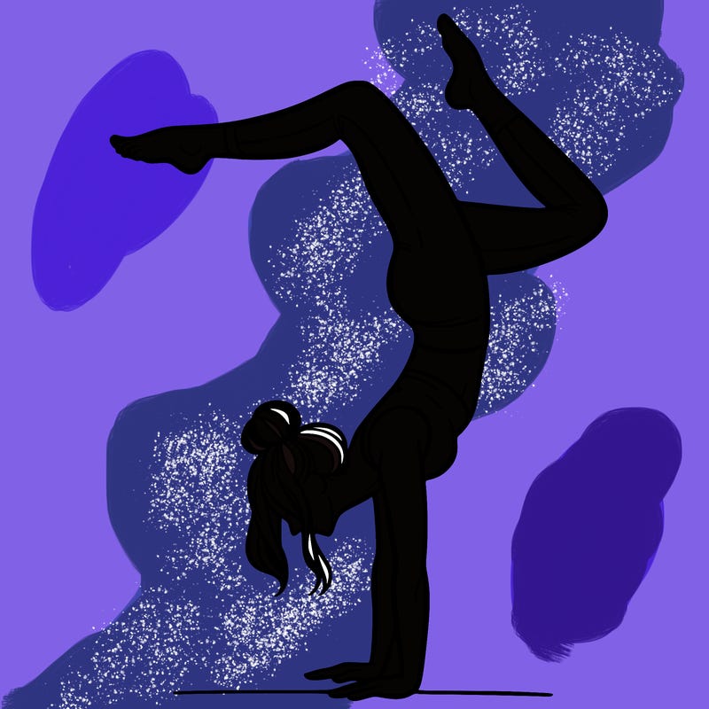 a woman doing a handstand