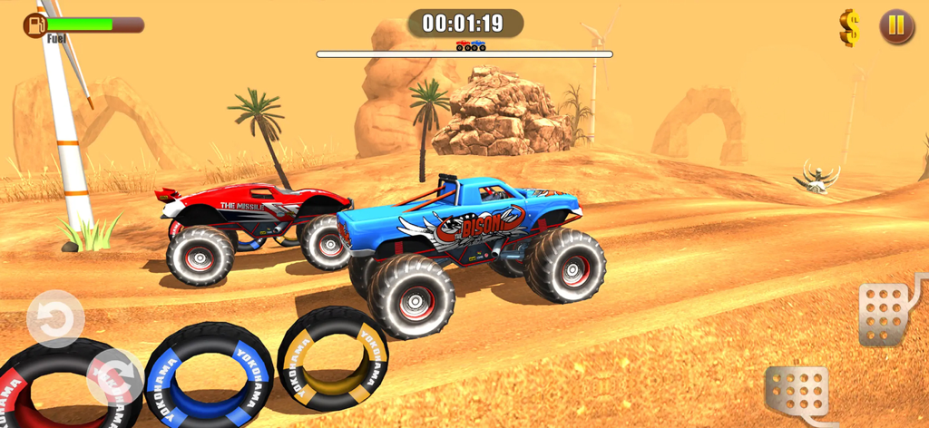 Blue and red monster trucks racing on a desert off-road track with windmills and dunes.