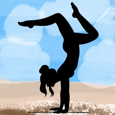 a woman doing a handstand