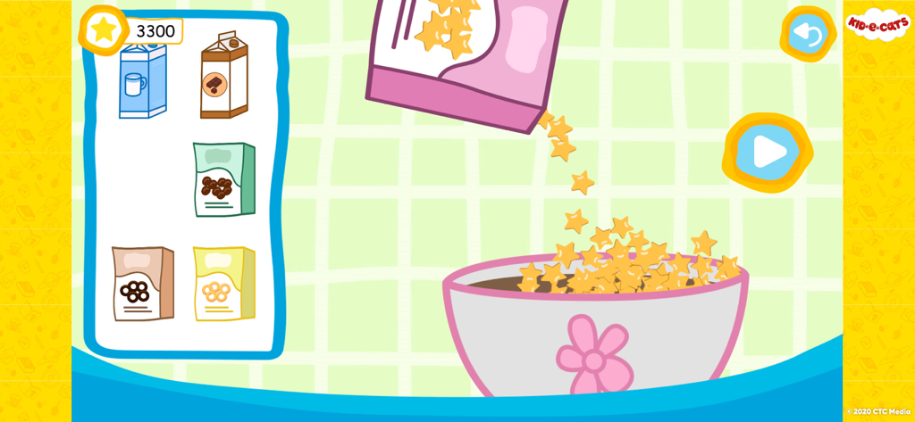 A day with Kid-E-Cats - Una pantalla de minijuego de la aplicación Kid-E-Cats que muestra cereales en forma de estrella vertiéndose en un tazón