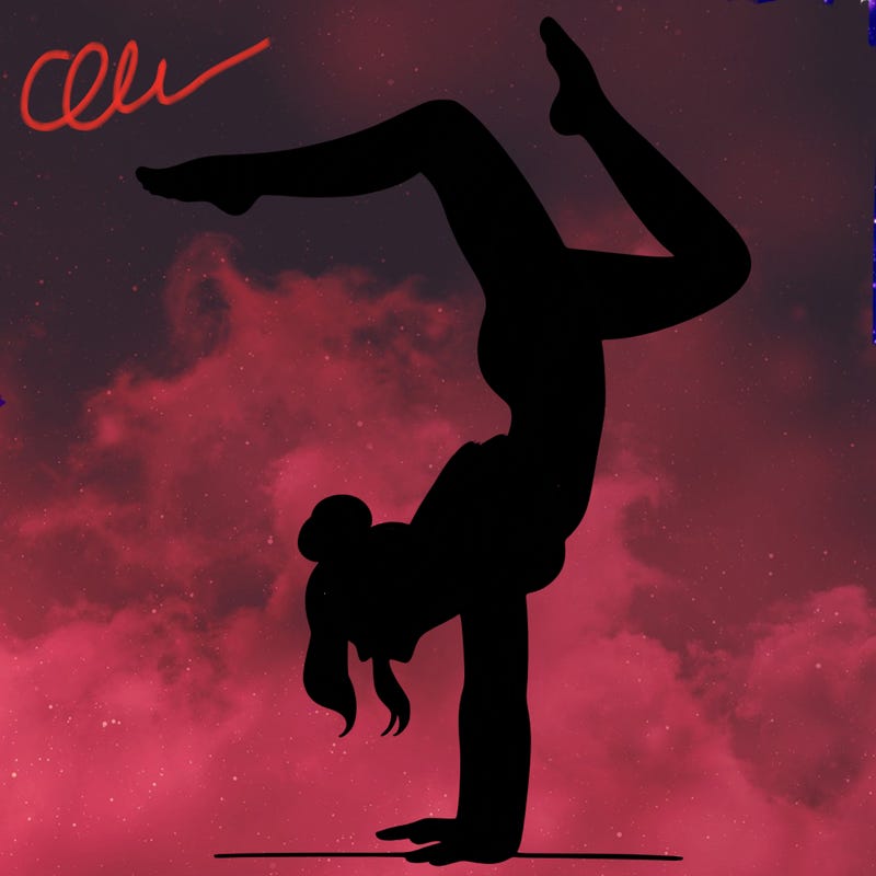 a woman doing a handstand