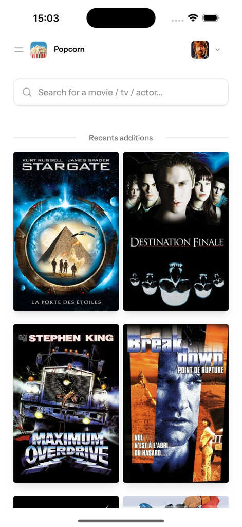 Popcorn movies app home screen featuring a search bar and a grid of recently added movie posters.