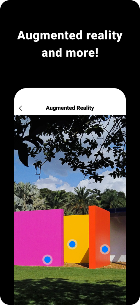 Interface de réalité augmentée dans GuideApp montrant des points interactifs sur une sculpture de musée colorée en extérieur.