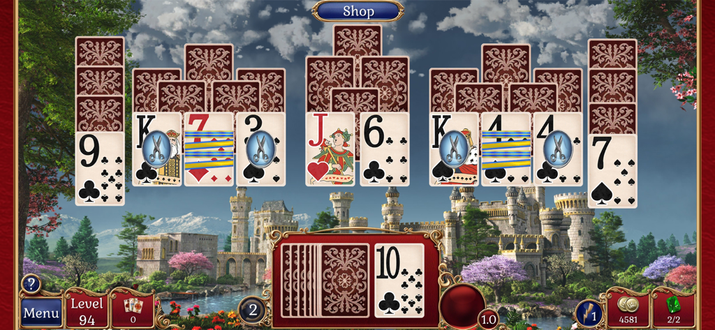 Jewel Match Solitaire - Jugabilidad de Jewel Match Solitaire mostrando pilas de cartas frente a un paisaje de castillo medieval