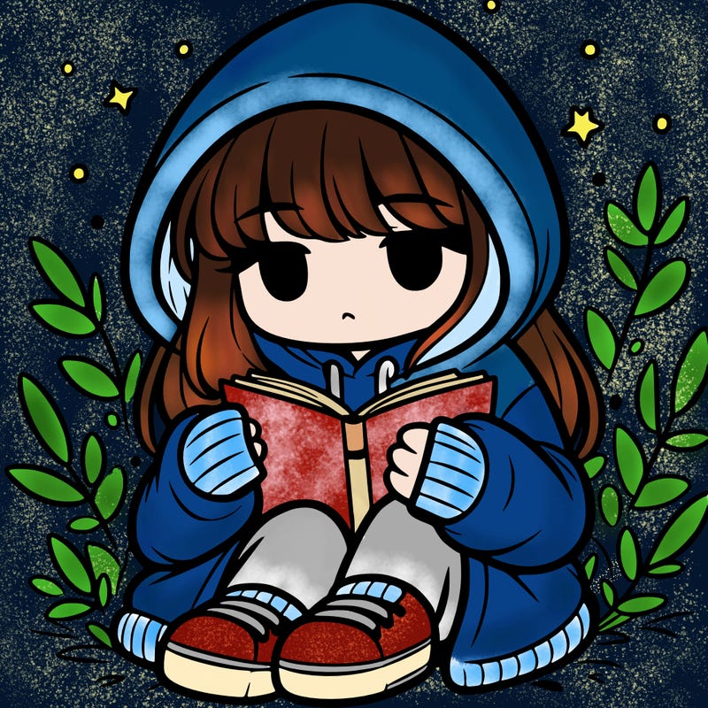 girl in oversized hoodie reading a book