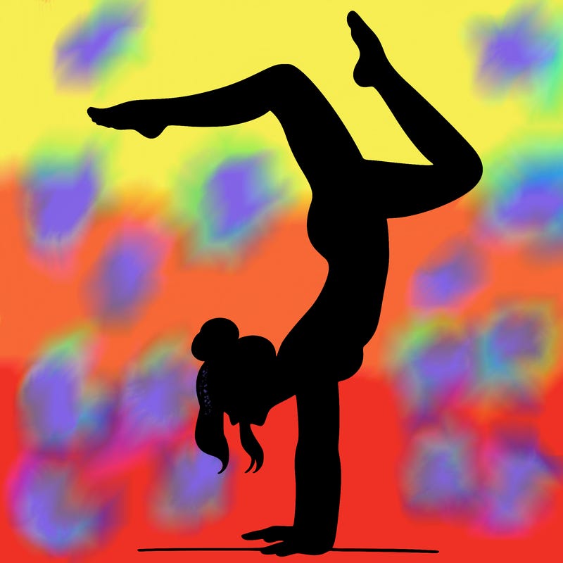 a woman doing a handstand