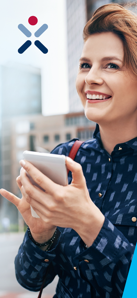 A smiling woman holding a smartphone using the TARGOBANK mobile banking app in a city setting.