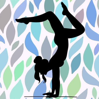 a woman doing a handstand