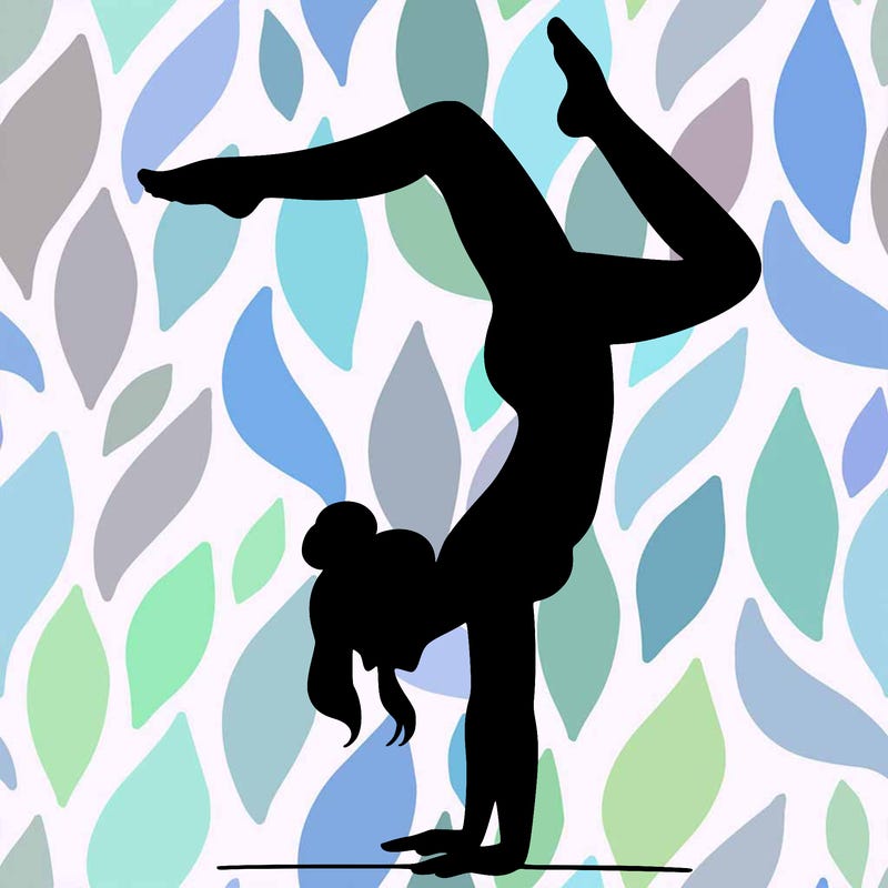 a woman doing a handstand