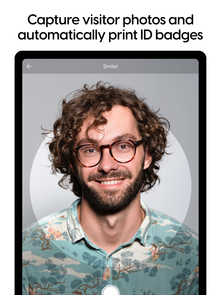 iPad screen displaying visitor photo capture for automated ID badge printing