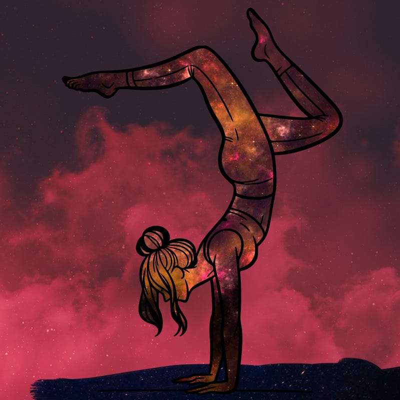 a woman doing a handstand