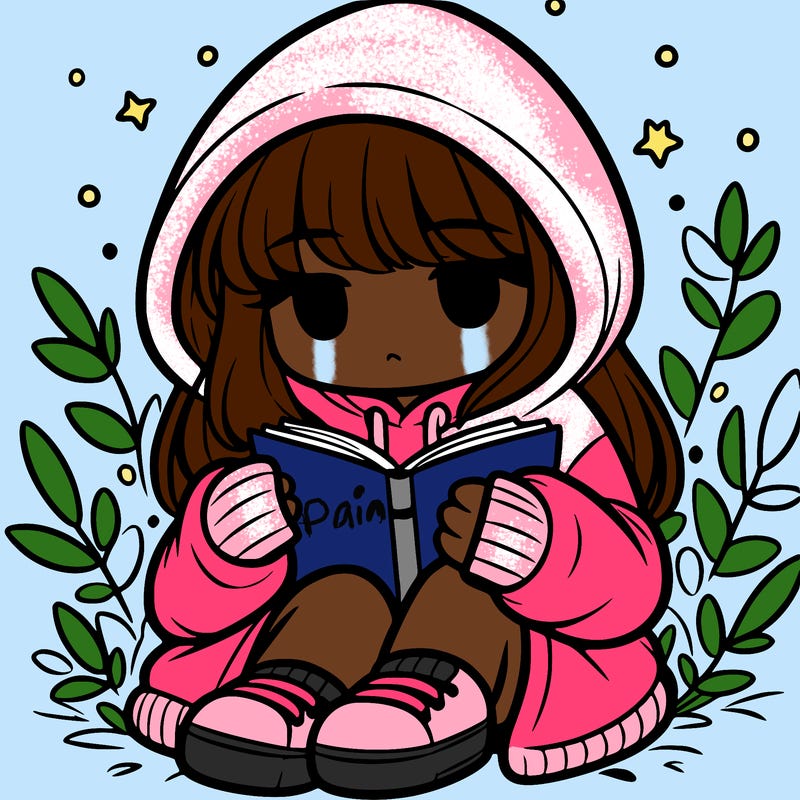 girl in oversized hoodie reading a book