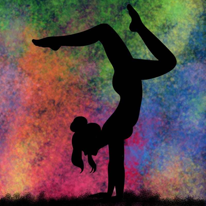 a woman doing a handstand