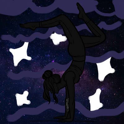 a woman doing a handstand