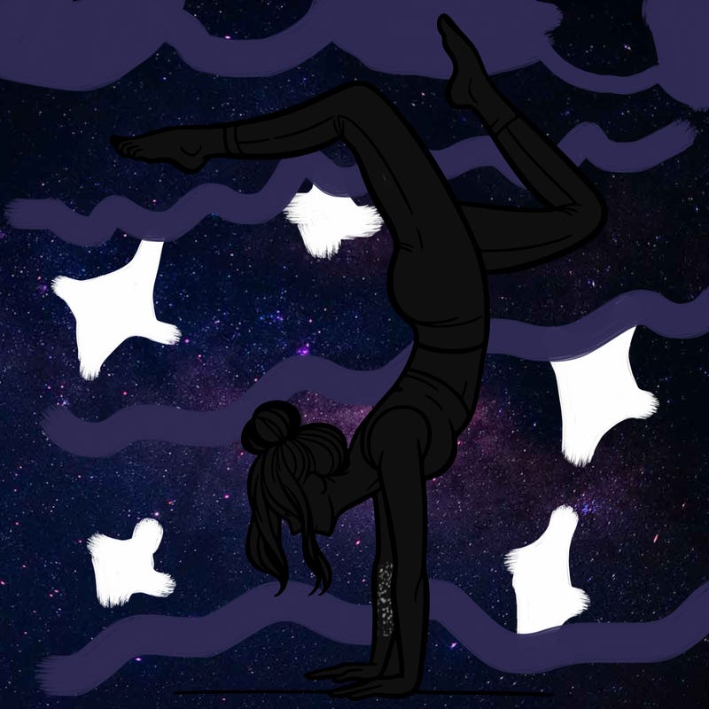 a woman doing a handstand