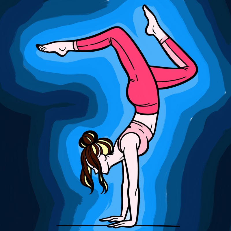 a woman doing a handstand