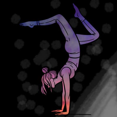 a woman doing a handstand