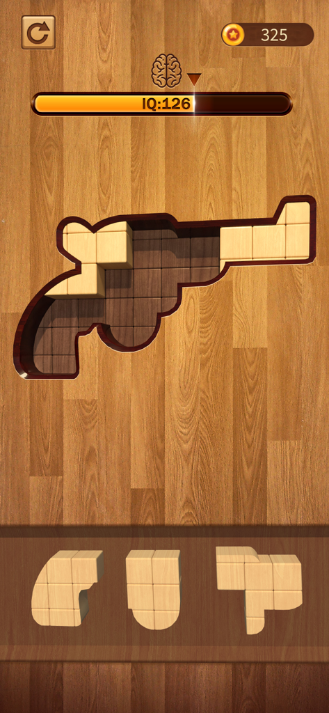 Mobile gameplay of BlockPuz showing wooden block pieces being fitted into a shaped outline on a wood background