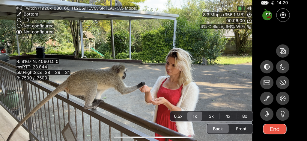 Moblin - Moblin app interface showing a high-performance live stream on Twitch with technical bitrate and connection data overlays during an outdoor broadcast.