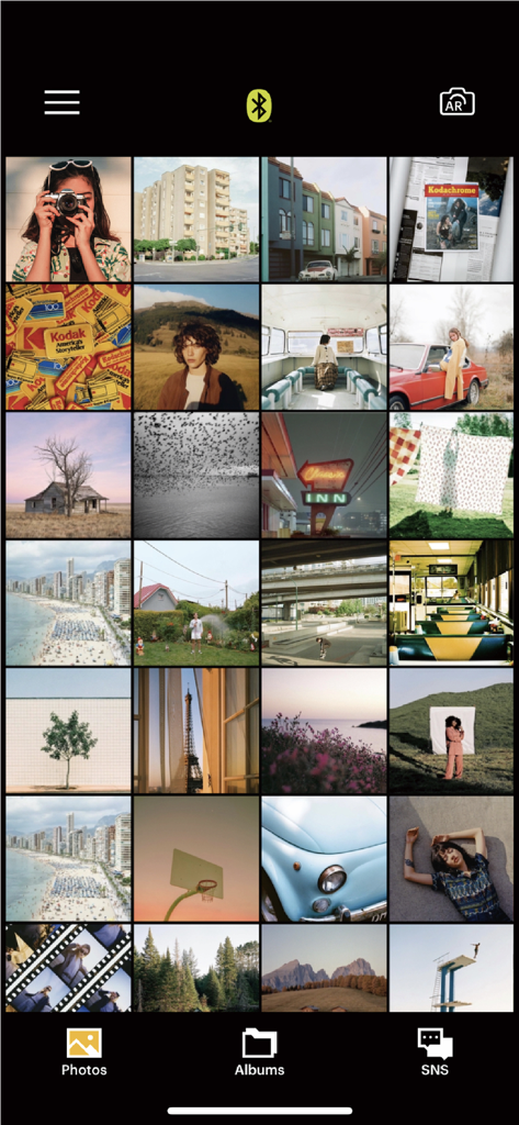 Kodak Photo Printer app gallery showing a grid of aesthetic photos for selection and printing
