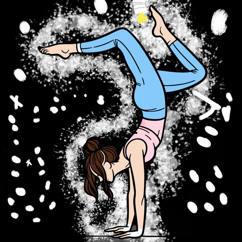 a woman doing a handstand