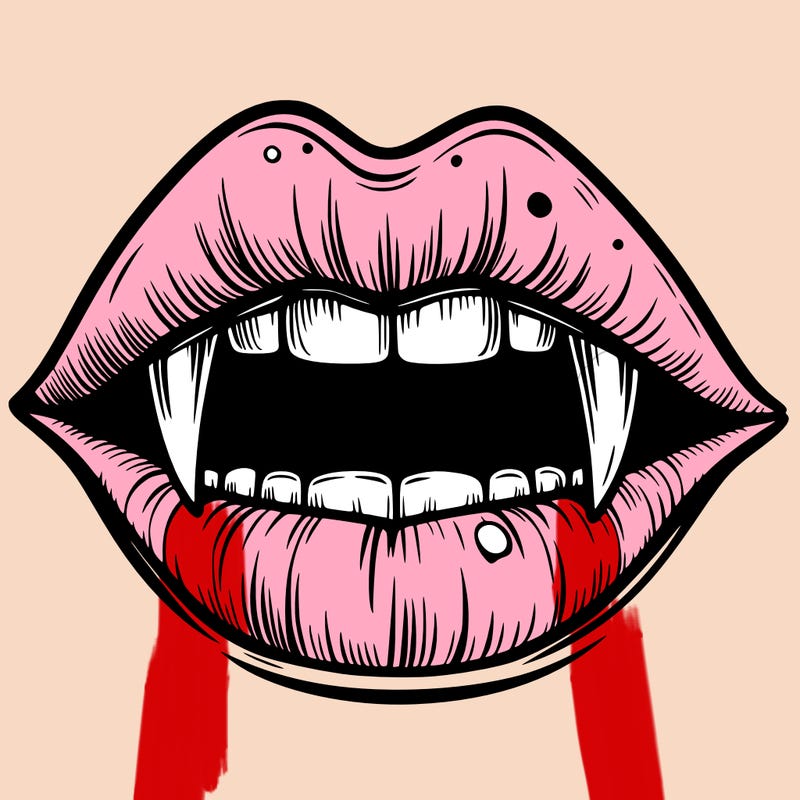 lips with vampire teeth