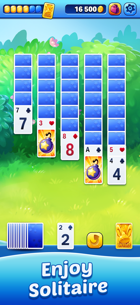 Solitaire Showtime - Solitaire Showtime gameplay screen showing tri-peaks card layout with bomb boosters in a lush green garden