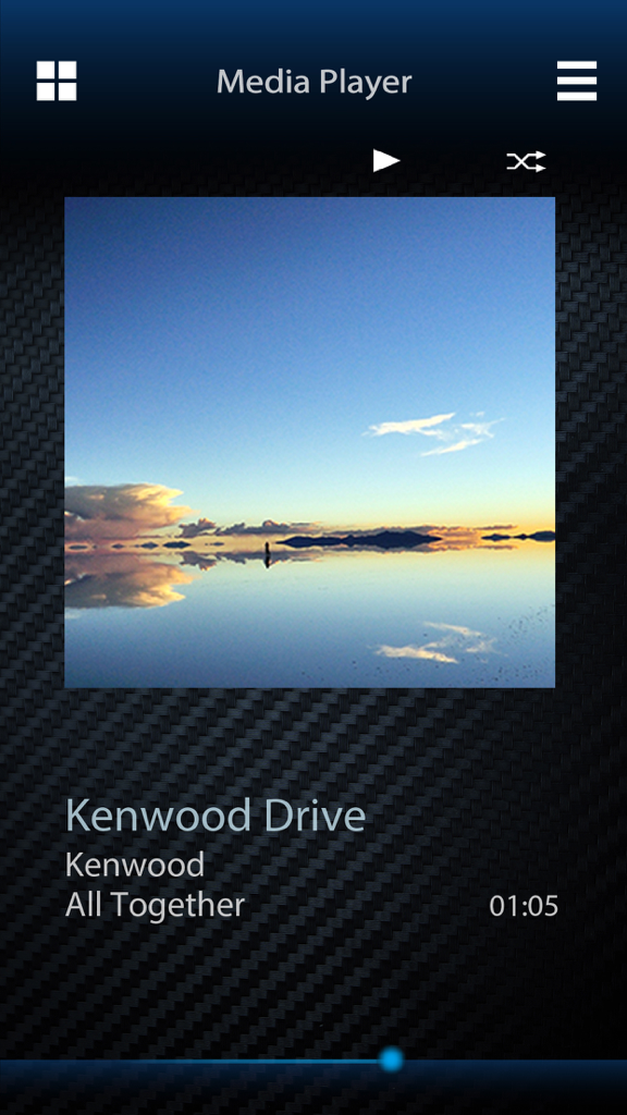 KENWOOD Remote app media player interface displaying song information and album artwork on a carbon fiber background