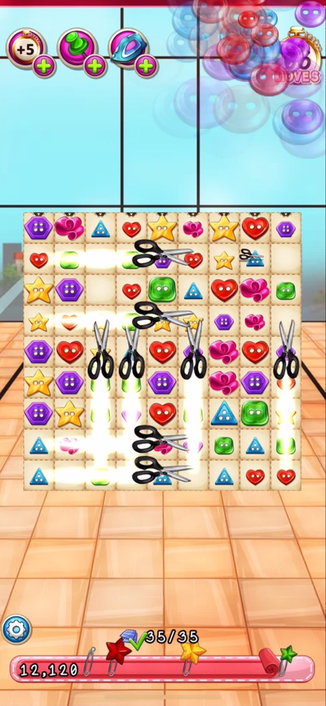 Gameplay of Fancy Tale showing a match-3 board with colorful buttons and scissors power-ups