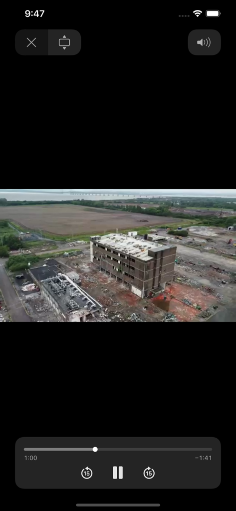 Aerial view of a construction site within the mobile app video player