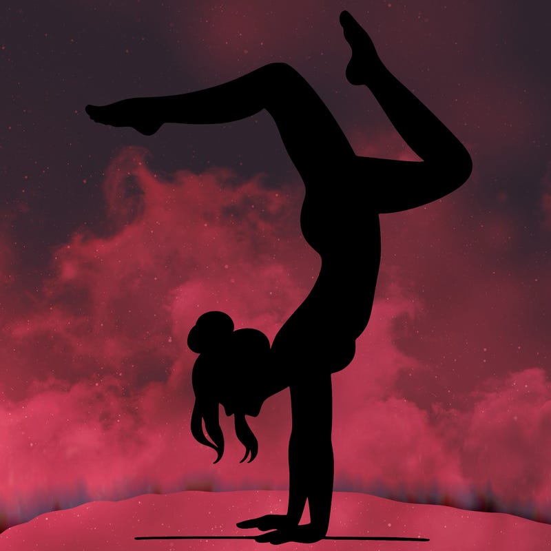 a woman doing a handstand