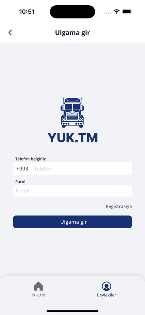 Login screen of the YUK.TM logistics app featuring a truck logo and input fields for phone number and password