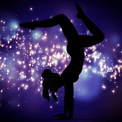 a woman doing a handstand