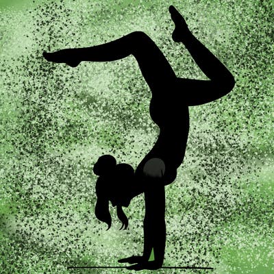 a woman doing a handstand