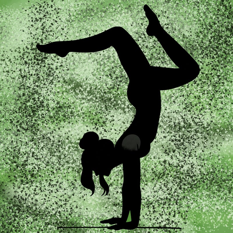 a woman doing a handstand