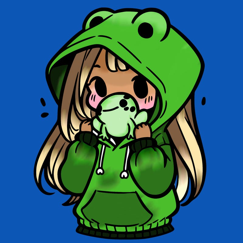 a girl holding a froggy hoodie