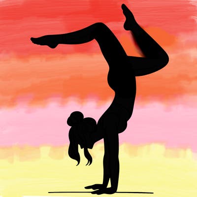a woman doing a handstand