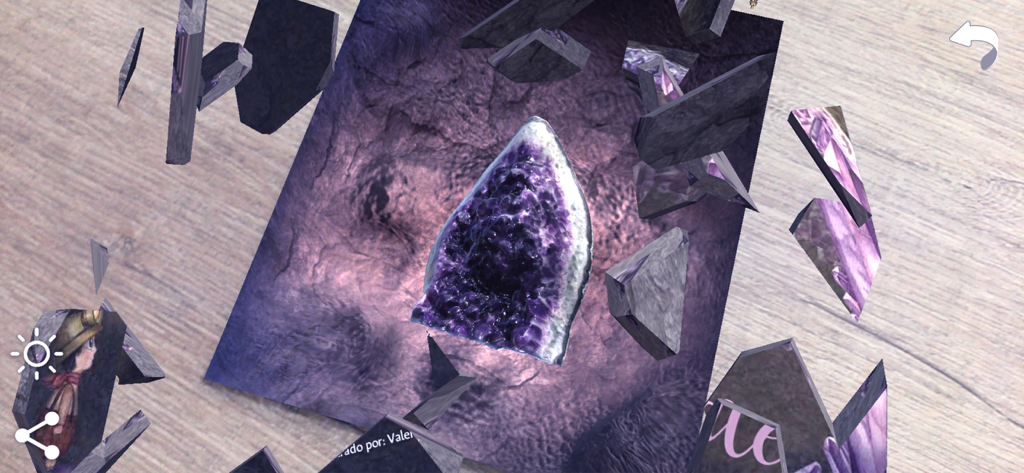 Naddie AR - Augmented reality view of a 3D amethyst geode crystal with floating fragments